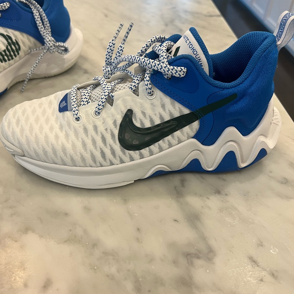 Nike blue and white tennis shoe. Size 5
